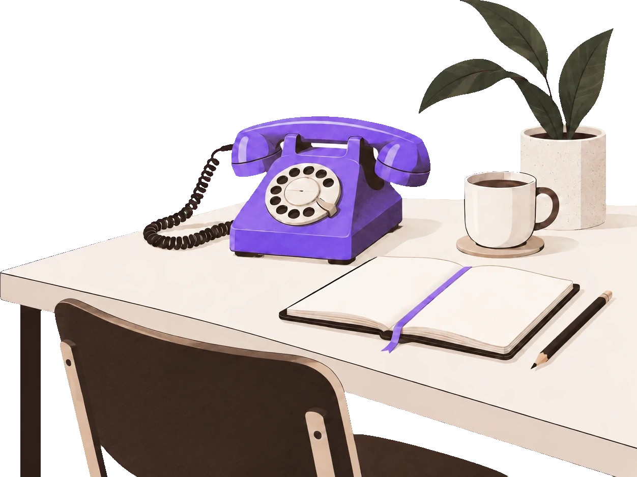 A desk with a phone, a notebook and a cup of coffee